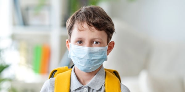 boy in mask with backpack